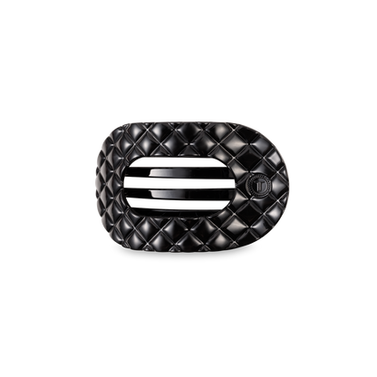 Black quilted rectangular buckle with rounded edges, two slots, small circular emblem; available in small and large sizes.