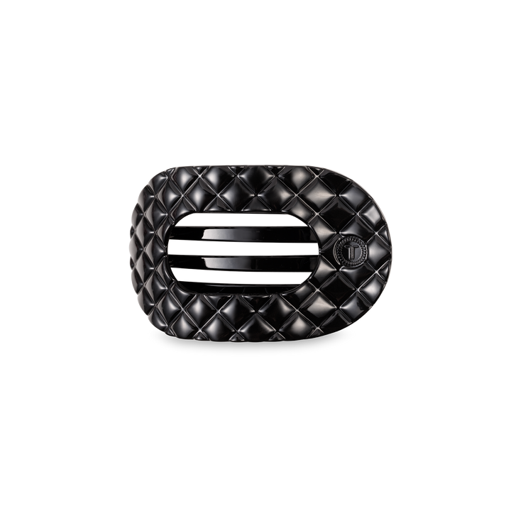 Black quilted rectangular buckle with rounded edges, two slots, small circular emblem; available in small and large sizes.