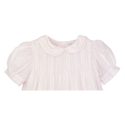 Light pink baby dress with pintucks, featherstitching, puff sleeves, Peter Pan collar. Sizes: NB-24M.