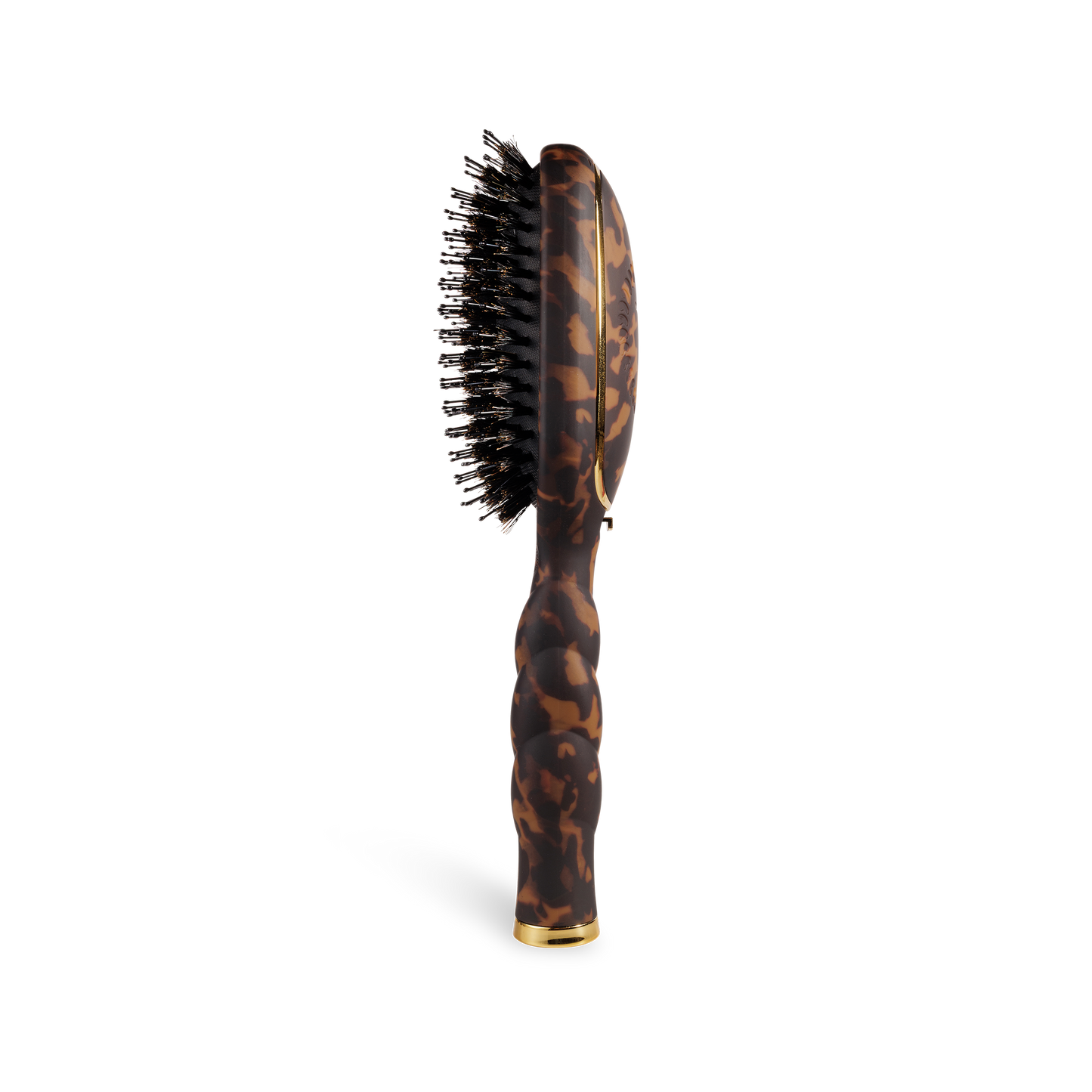 The Boar Bristle Hair Brush | Tortoise has a tortoiseshell handle, black boar bristles. Available in regular and travel sizes.