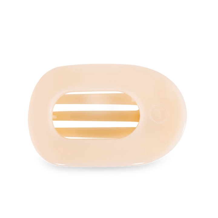 A beige TELETIES Flat Round Hair Clip designed with slotted openings for drainage. Available sizes: Small, Large.