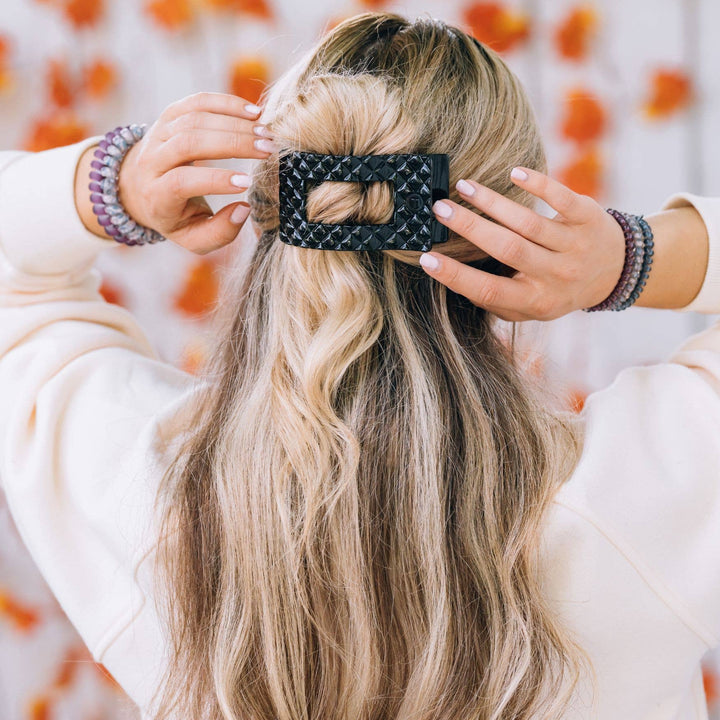 Large black TELETIES Flat Rectangle Hair Clip secures half-up style. Available in small, medium, and large sizes.