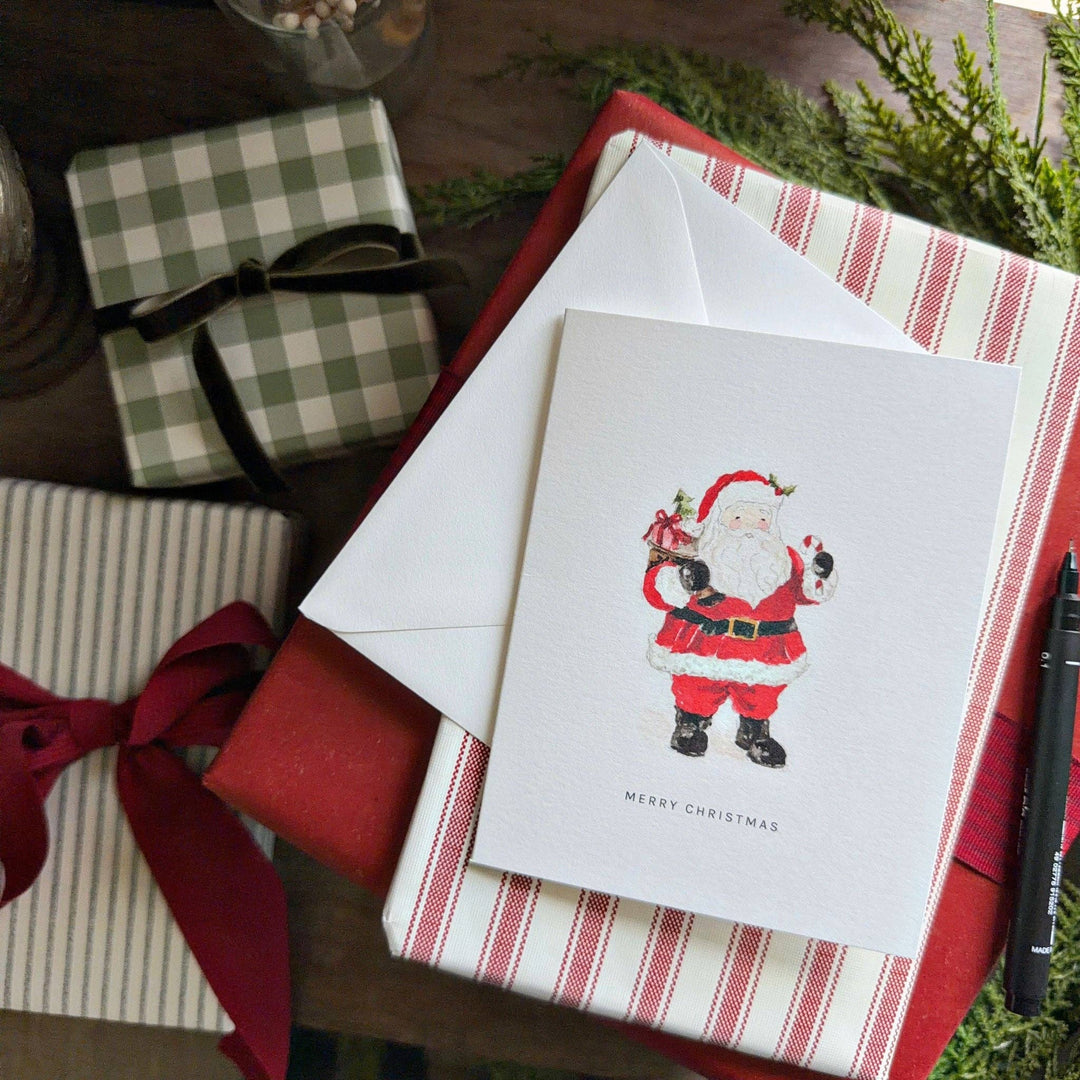 Santa greeting card with “Merry Christmas” illustration. Available in various sizes.