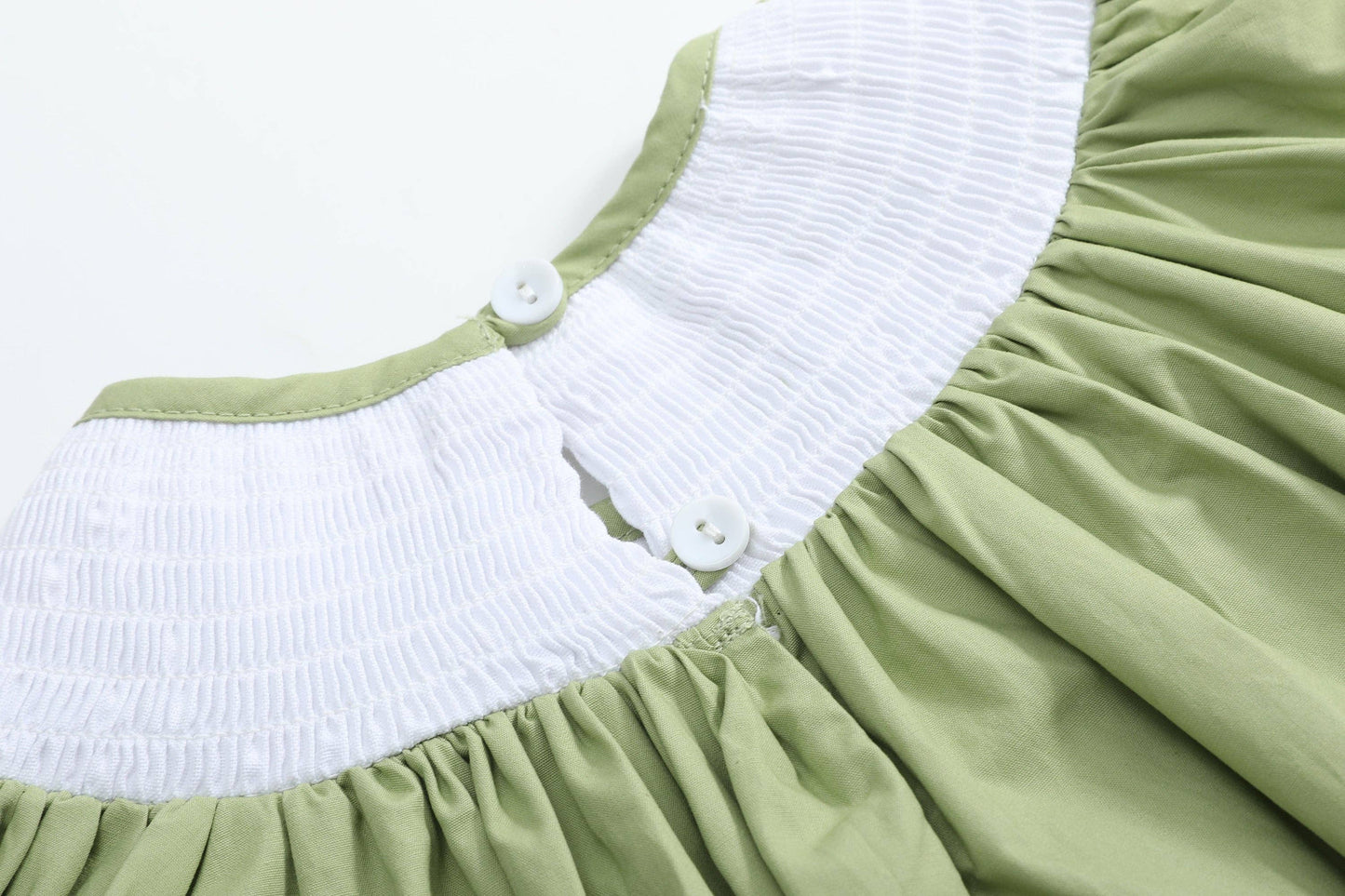 Pistachio Green Mallard Duck Smocked Bishop Dress for ages 18-24M with a smocked white collar and two white back buttons.