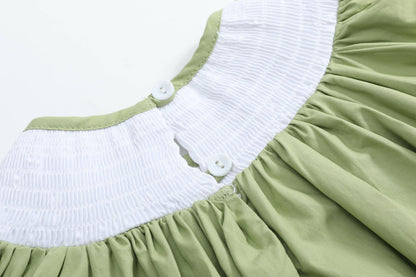 Pistachio Green Mallard Duck Smocked Bishop Dress for ages 18-24M with a smocked white collar and two white back buttons.