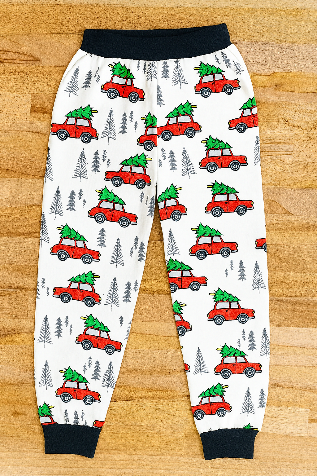 “You Serious Clark? Cotton 2-Piece Boy Clothes Set” in size 4-5T includes white pajama pants with a playful print of red cars carrying Christmas trees and gray pine trees.