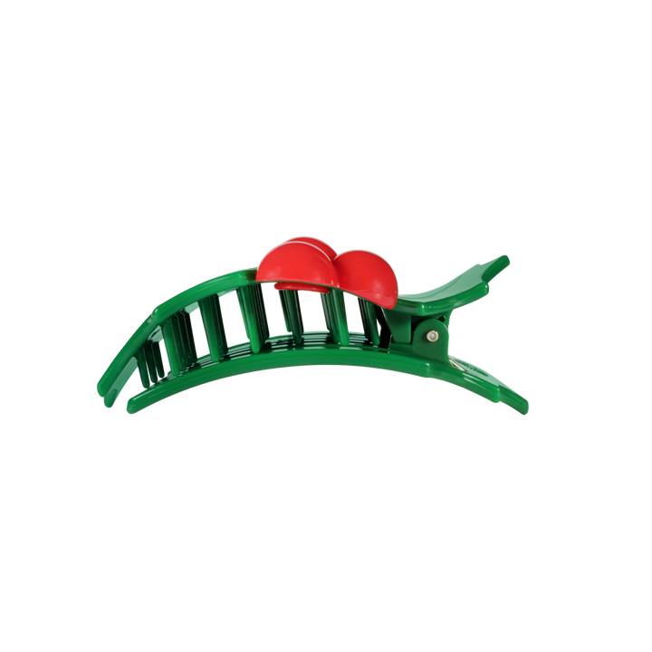 Glitter Holly Leaves flat hair clip in a green arched design with two red rounded ornaments.