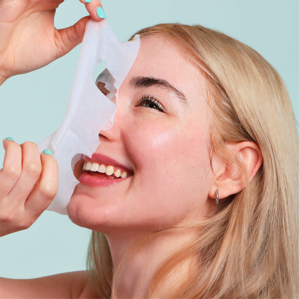 Korean Fruit Infused Face Mask being peeled off. Available sizes: single-use, 5-pack, 10-pack.