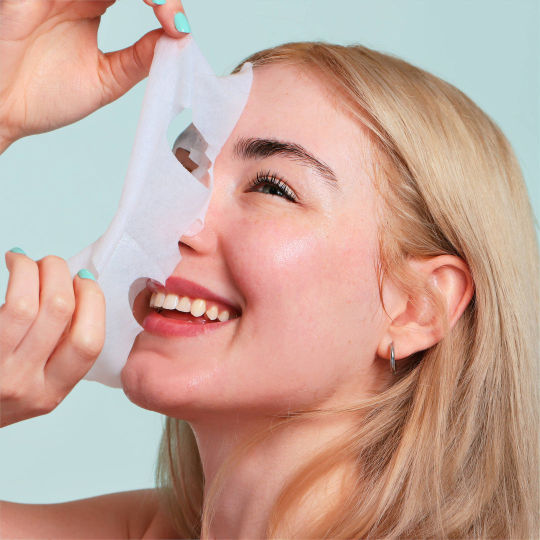 Korean Fruit Infused Face Mask being peeled off. Available sizes: single-use, 5-pack, 10-pack.