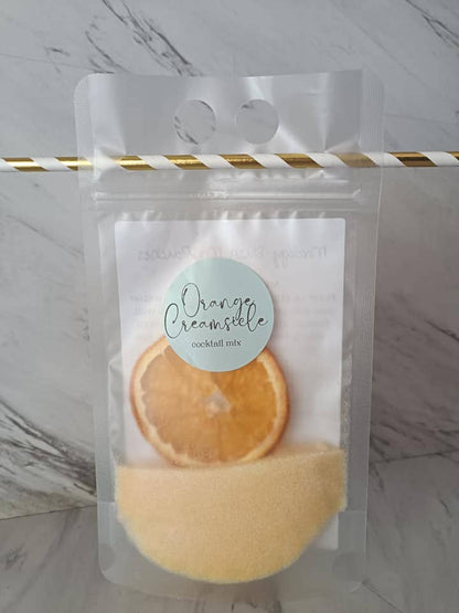 Clear pouch labeled "Adult Slush Drink Pouches" with dried orange slice and yellow powder. Available in 8oz, 13oz, and 16oz sizes.