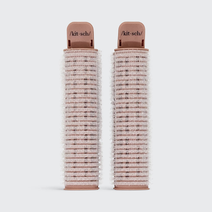 Two pink Volumizing Roller Clips with white bristles, "/kit·sch/" labeled. Available in small and large sizes.