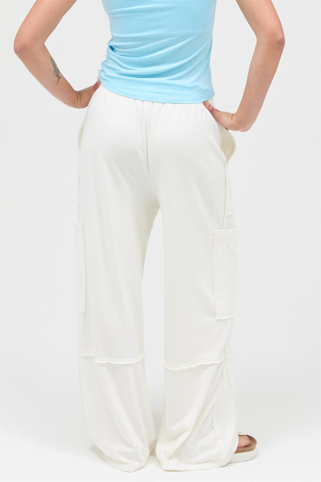 White Mineral Wash Wide Leg Cargo Pants with large side pockets. Available in sizes XS–XL.