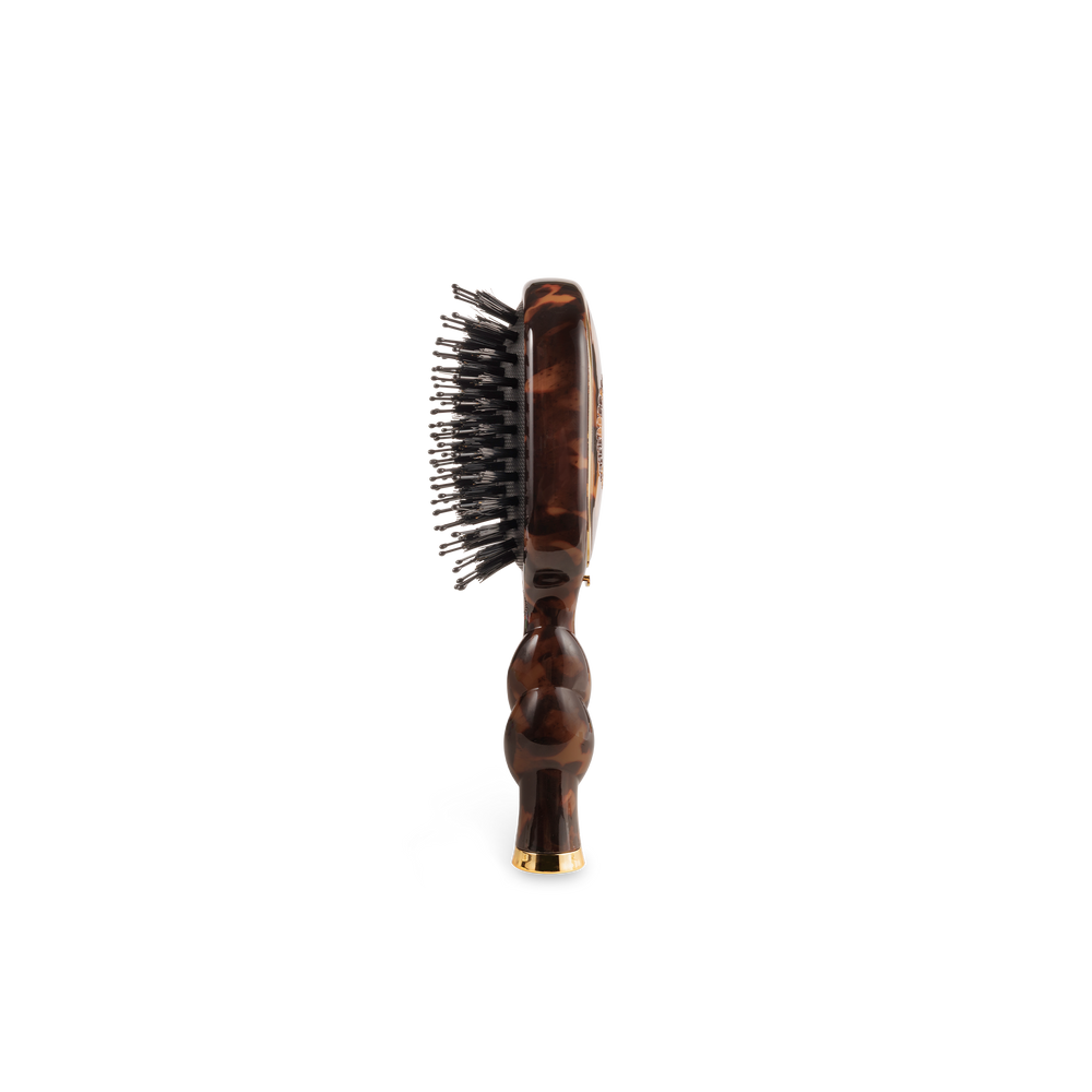 The Mini Boar Brush | Tortoise with a wavy handle and metal bristles. Available in mini size.