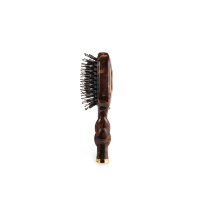 The Mini Boar Brush | Tortoise with a wavy handle and metal bristles. Available in mini size.
