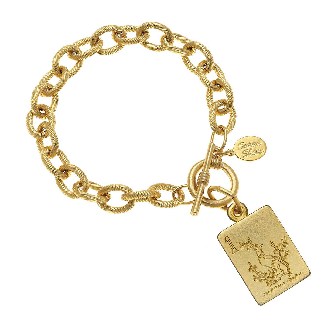 24K gold chain bracelet with toggle clasp, mahjong “1” engraved pendant, small "Seven Silver" tag. Sizes: S, M, L.