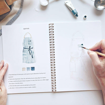 Spiral-bound Baking watercolor workbook with sketched apron designs and baking illustrations; available in standard notebook size.