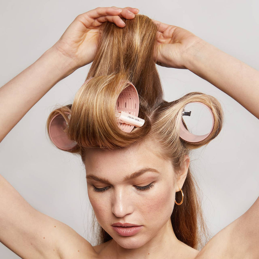 Recycled Plastic XL Ceramic Thermal Rollers 4pc Set in Terracotta, available in XL size, shown lifting hair for volume.