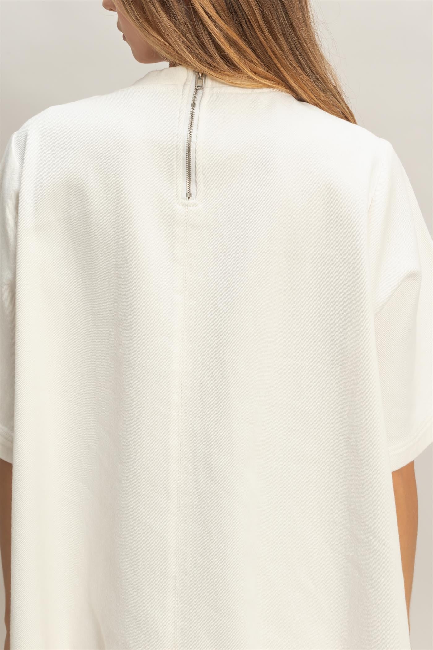 White Crew Neck Denim Tunic with loose silhouette and visible upper back zipper. Available in sizes XS–XL.