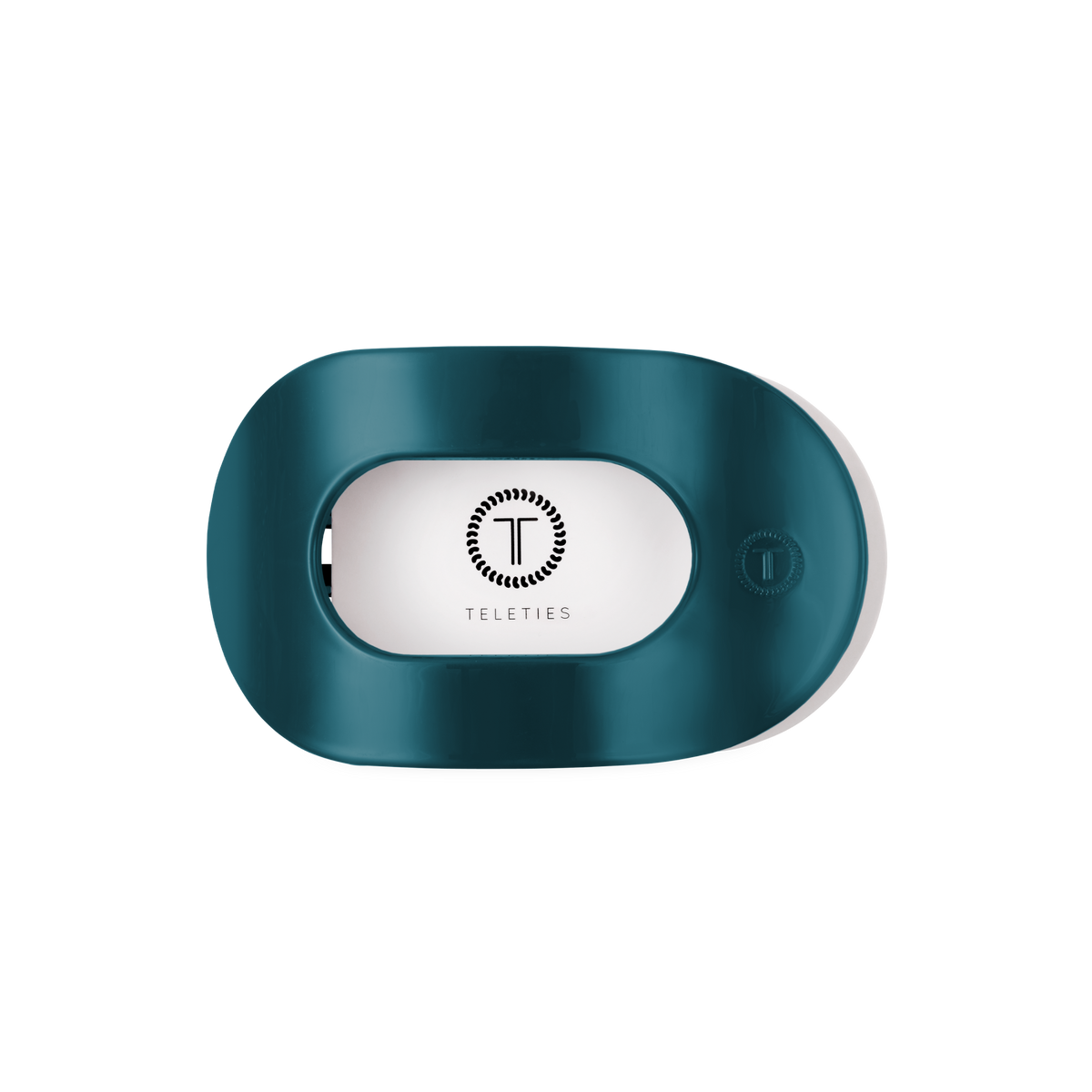 Teal “Teal With It Medium Flat Round Hair Clip” by TELETIES, oval-shaped with a rectangular center opening, features the TELETIES logo and name inside; available in medium size.
