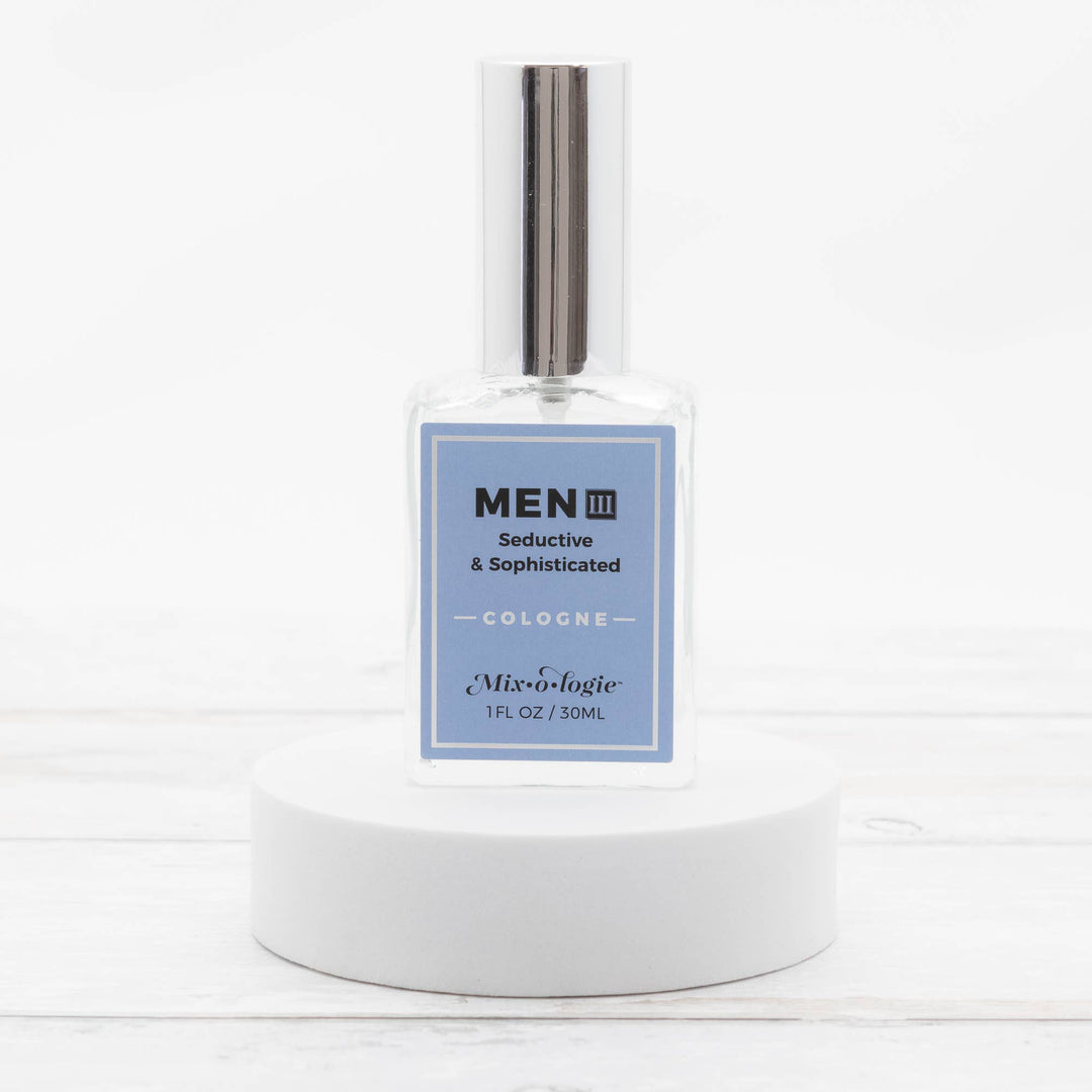 Clear glass bottle of Men’s III Cologne Spray, 30mL, silver cap, "Mix•o•logie" label. Available in 30mL size.