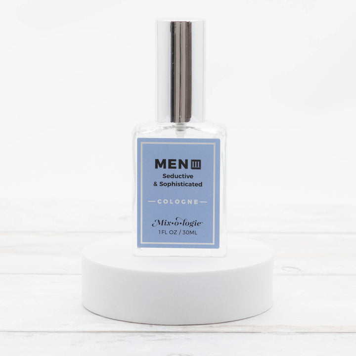 Clear glass bottle of Men’s III Cologne Spray, 30mL, silver cap, "Mix•o•logie" label. Available in 30mL size.