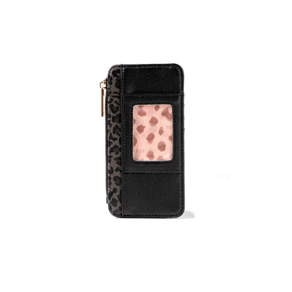 The Kedzie Essentials Only Zippered Wallet Open Stock: Wild Card is a compact black vegan leather wallet with a zipper, transparent ID slot, and leopard print detailing. Sizes available.