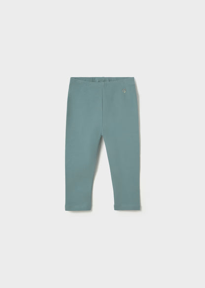 Blue-green cotton leggings set with elastic waistband and small decorative emblem near the top; available in little girl sizes.