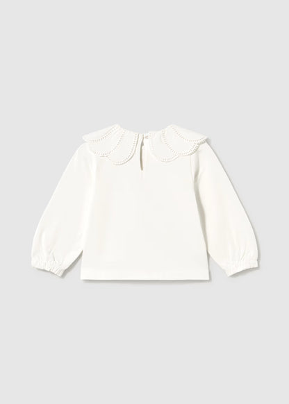 White long-sleeve blouse with a scalloped embroidered Peter Pan collar, eyelet trim, back button keyhole, and gathered balloon cuffs. Available in sizes 2T-6Y.