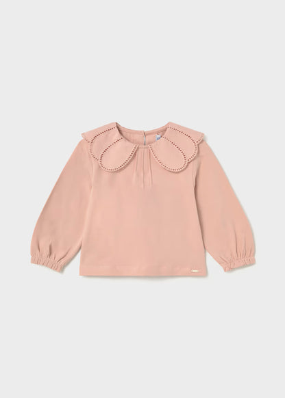 Light pink long-sleeve shirt with wide petal collar, decorative eyelet trim cutouts, elastic balloon sleeves, and relaxed fit. Available in sizes 2T-6.