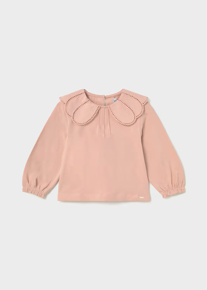 Light pink long-sleeve shirt with wide petal collar, decorative eyelet trim cutouts, elastic balloon sleeves, and relaxed fit. Available in sizes 2T-6.