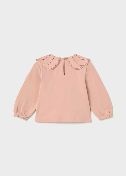 Light pink long-sleeve blouse with double-layered scalloped petal collar, elastic cuffs, and buttoned keyhole back. Available in sizes 2T-6T.