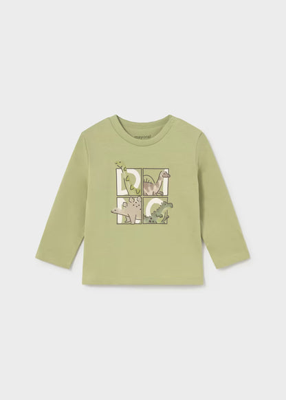Light green toddler long sleeve t-shirt with puzzle piece and dinosaur designs on the chest, featuring four dinosaurs in green and beige. Made from 100% cotton. Available in toddler sizes.