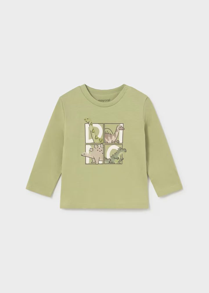 Light green toddler long sleeve t-shirt with puzzle piece and dinosaur designs on the chest, featuring four dinosaurs in green and beige. Made from 100% cotton. Available in toddler sizes.