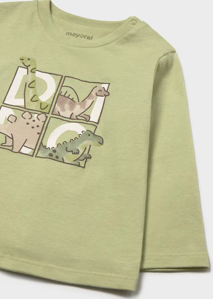 Light green long sleeve t-shirt for children with four cartoon dinosaurs in square sections on the front and “mayoral” near the neckline. Made from 100% cotton. Available in sizes for little boys.