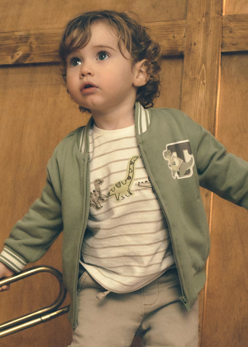 Little Boy Dino Stripe Long Sleeve Shirt, available in sizes 2T-5T.