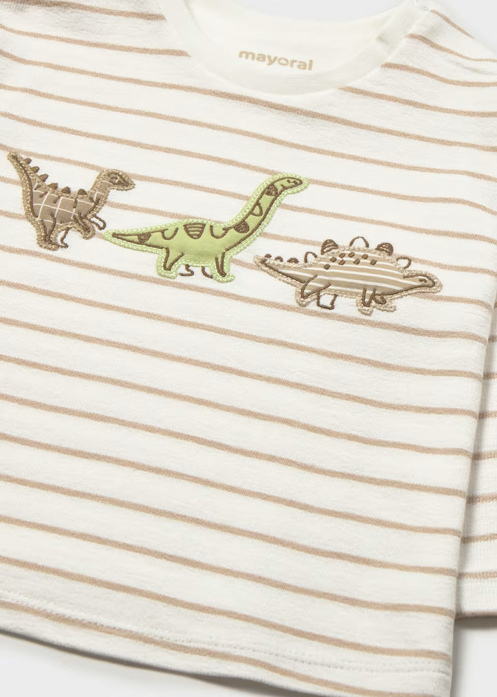 White and beige striped 100% cotton long sleeve children’s shirt with three embroidered dinosaurs (brown, green, gray) on the chest; available in sizes 2T–5T.