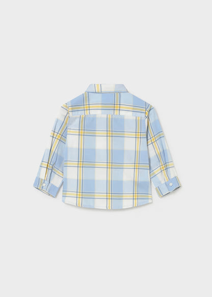 The Little Boy Plaid Woven Cotton Shirt features a light blue, yellow, and white plaid pattern. Made from lightweight cotton with long sleeves and button-up front. Available in sizes 2T-7.