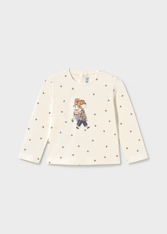 Little Girl Printed Long Sleeve T-Shirt with cream sleeves, brown heart patterns, glitter dot accents, and a central illustrated motif; available in sizes 2T-6.