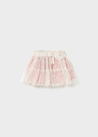 Baby Tulle Skirt for children with white floral embroidery, sheer tulle overlay, elastic waistband, and decorative bow. Available in sizes 12M–5T.