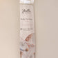 Packaging of a Pacifier Clip - Pink and Blue baby pacifier clip, featuring photos of infants using the product and social media contact information on a soft beige background. Each clip is made from BPA-free