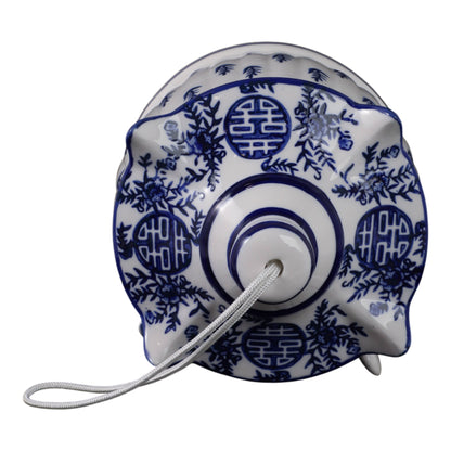 White/Blue Chinoiserie Pagoda Birdhouse, 8 in., with floral and circular patterns. Only available in 8-inch size.