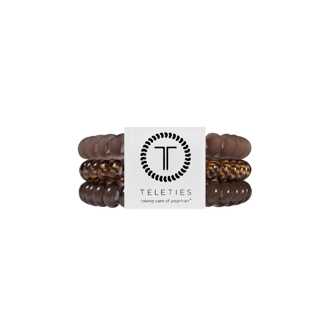 Set of three TELETIES Morning Brew Small Hair Ties with a brown spiral coil design and a white branded label at the center. Available in small size. Waterproof, no-crease, and designed to prevent dents and kinks.