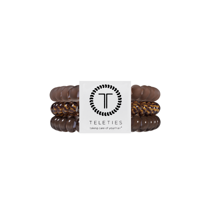 Set of three TELETIES Morning Brew Small Hair Ties with a brown spiral coil design and a white branded label at the center. Available in small size. Waterproof, no-crease, and designed to prevent dents and kinks.