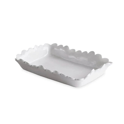 Rectangular white ceramic guest towel holder with ruffled, wavy edges. Available in one standard size.