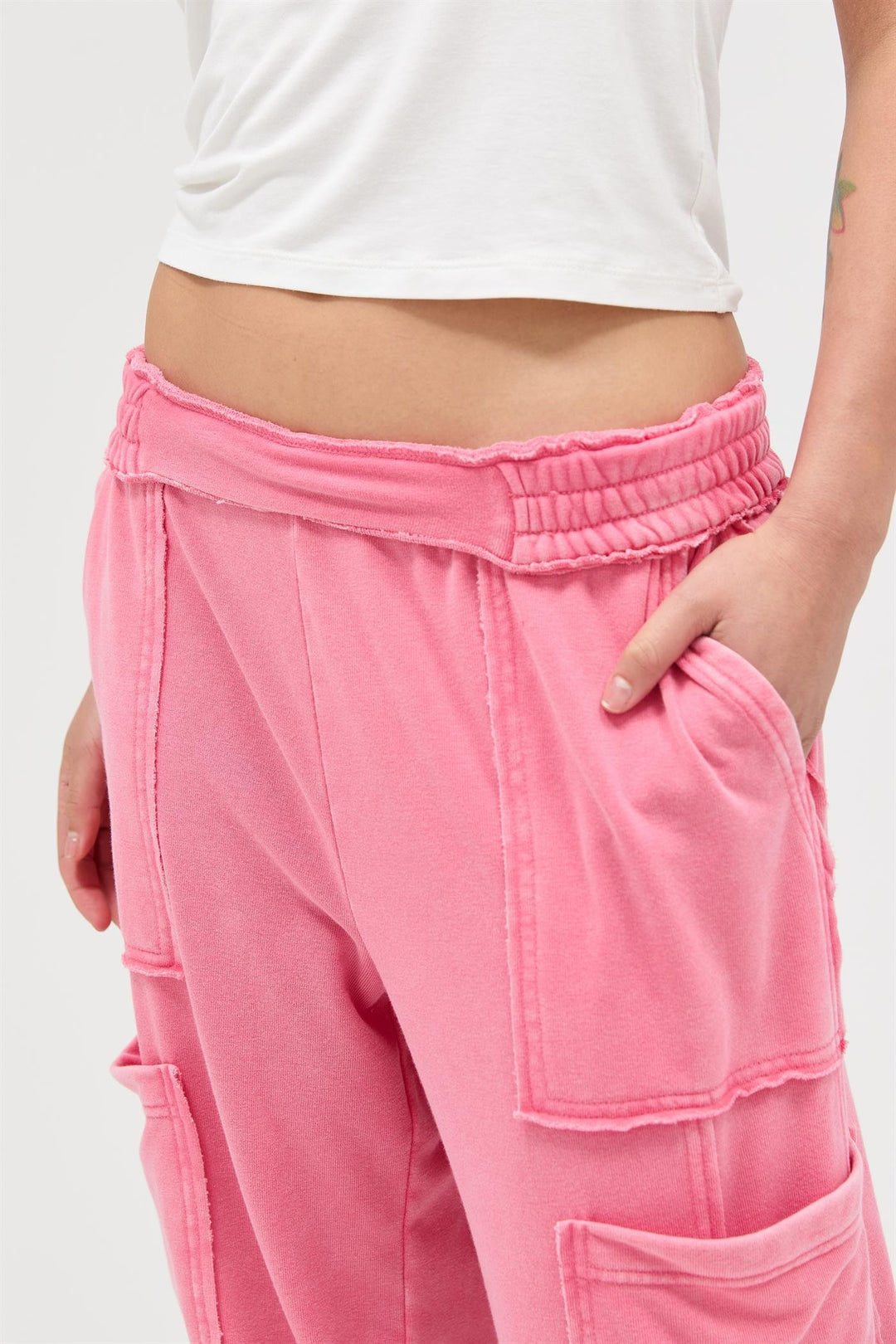 Bright pink Mineral Wash Wide Leg Cargo Pants with large patch pockets and raw seams. Available in XS-XL.