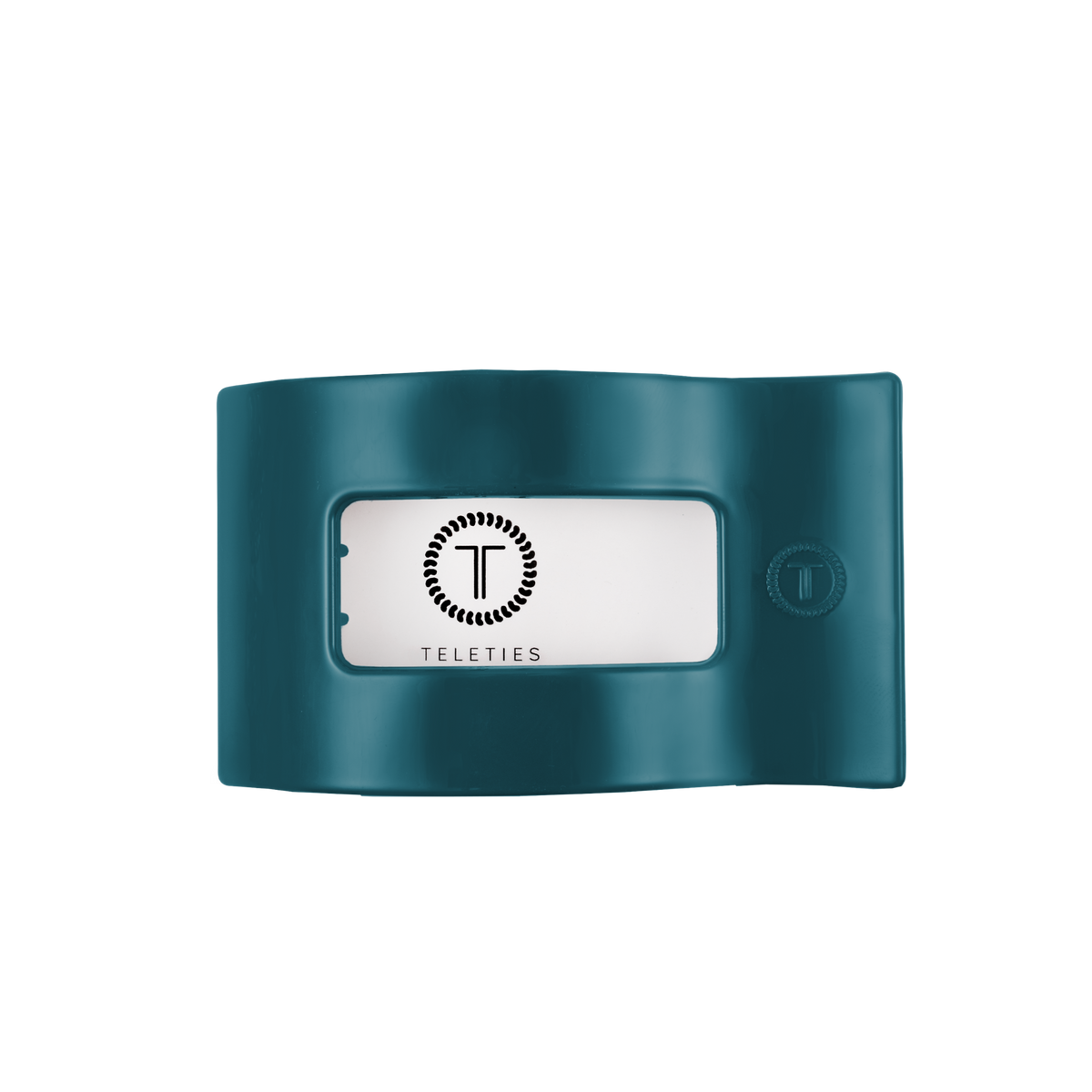 Teal flat rectangular hair clip with a center window displaying the TELETIES logo in black on white; available in medium size.