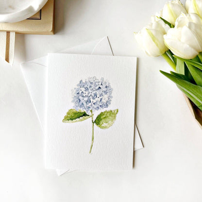 Hydrangea stem notecard with watercolor blue hydrangea and green leaves on white envelope. Available in A2, A6 sizes. Blank inside.
