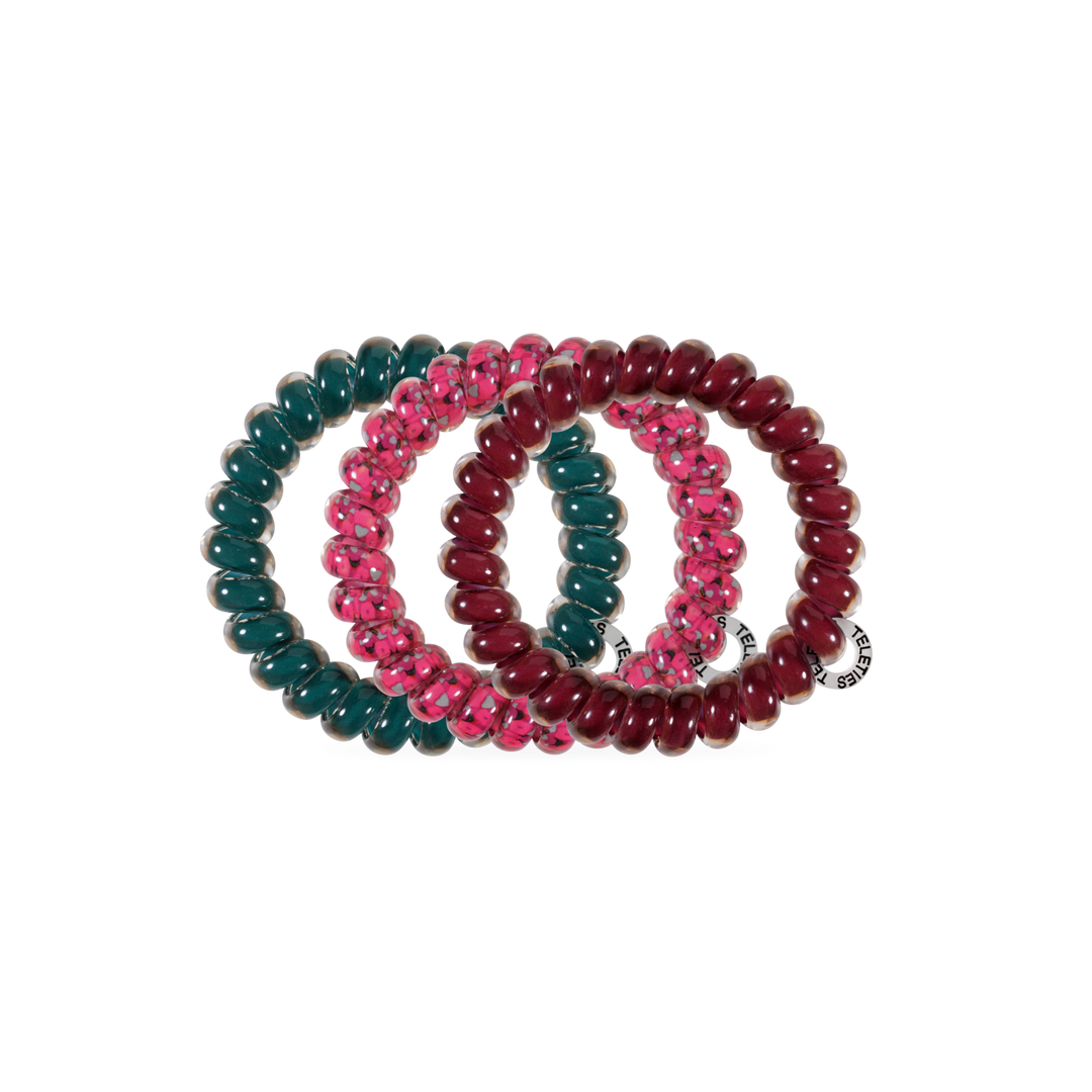Three Harvest Hues TELETIES Large Hair Ties in dark green, pink with a transparent pattern, and maroon, each with a small white tag. Available in large size.