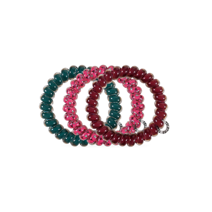 Three Harvest Hues TELETIES Large Hair Ties in dark green, pink with a transparent pattern, and maroon, each with a small white tag. Available in large size.