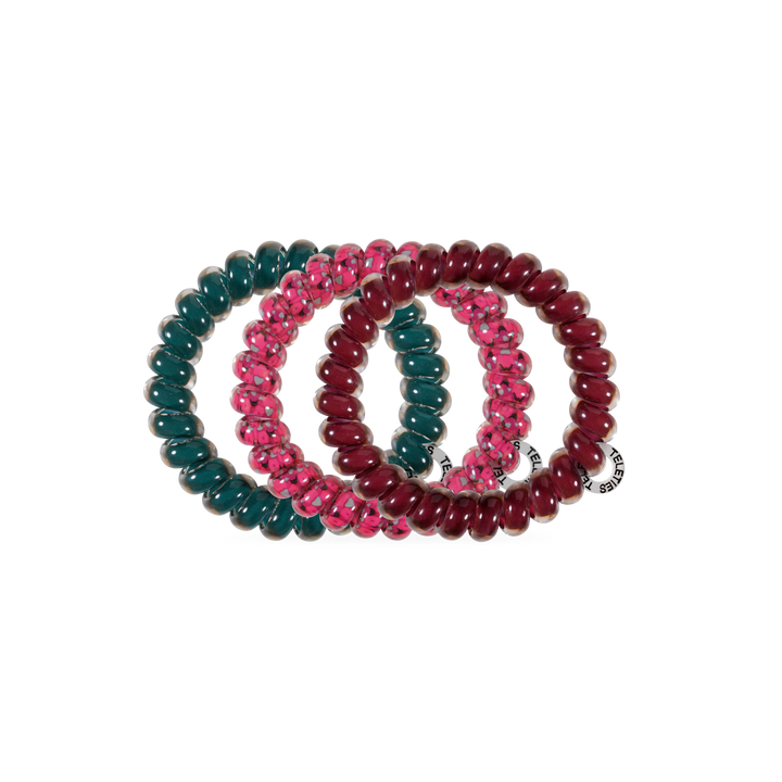 Three Harvest Hues TELETIES Large Hair Ties in dark green, pink with a transparent pattern, and maroon, each with a small white tag. Available in large size.